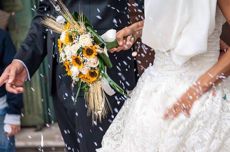 Rice being tossed at a wedding