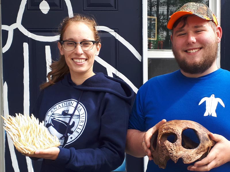 Laura and Colin holding leatherback 