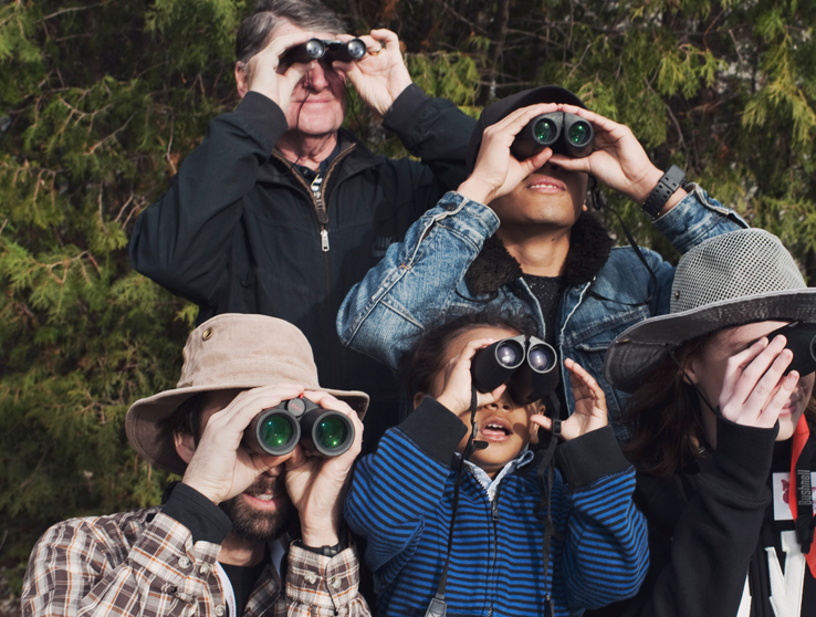 group of people with binoculars