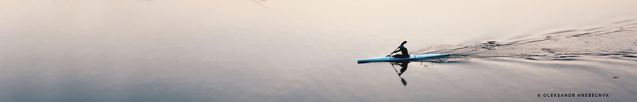 blue canoe on water 